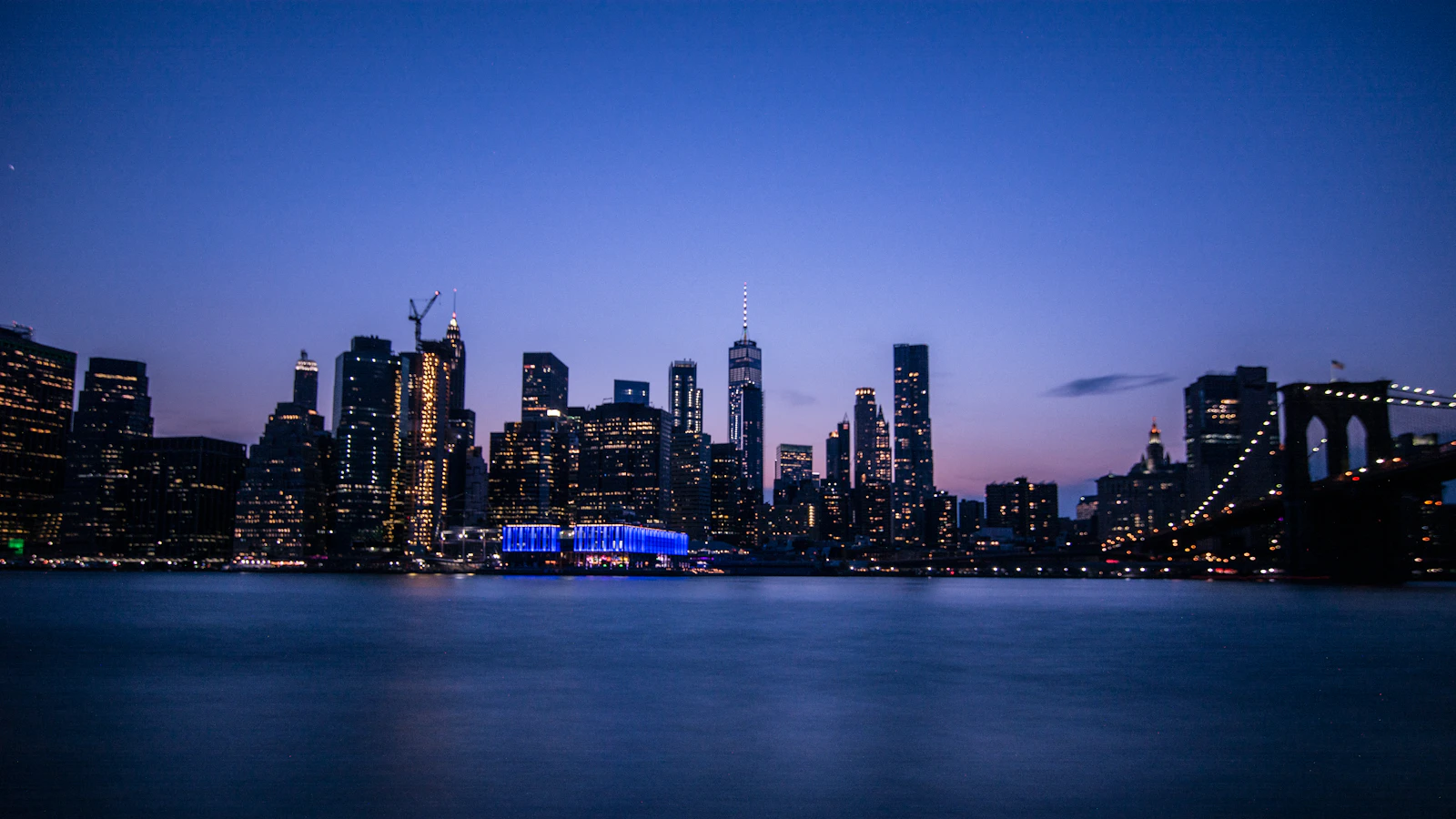 New York City skyline across the river at dusk