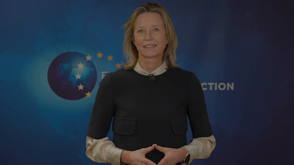 Kajsa Ollongren in front of the European Union flag